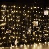 Миниатюра фото уличная светодиодная гирлянда uniel занавес 220v теплый белый uld-c2030-240/tbk warm white ip67 ul-00003938 | 220svet.ru